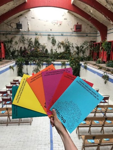 Year of Young People guides being held up