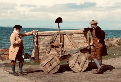 Waggonway with two people dressed from the old railway time